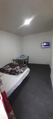 Un ou plusieurs lits dans un hébergement de l'établissement Hôtel des Andelys