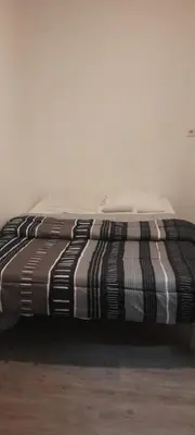 Un ou plusieurs lits dans un hébergement de l'établissement Hôtel des Andelys