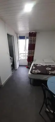 Un ou plusieurs lits dans un hébergement de l'établissement Hôtel des Andelys