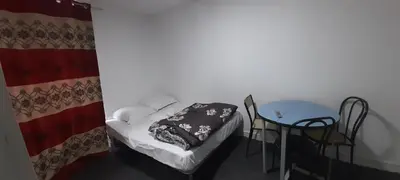 Un ou plusieurs lits dans un hébergement de l'établissement Hôtel des Andelys