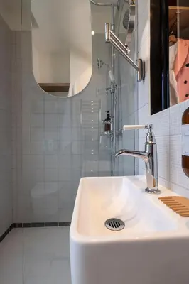 Salle de bains dans l'établissement Hôtel Le Daum