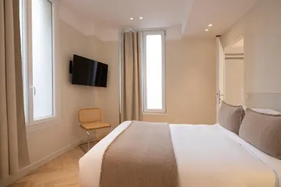 Télévision ou salle de divertissement dans l'établissement Hôtel Le Daum