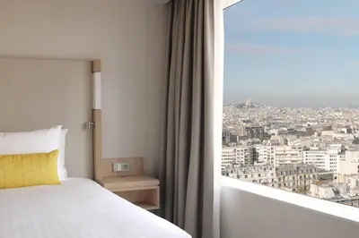 Un ou plusieurs lits dans un hébergement de l'établissement Courtyard by Marriott Paris Gare de Lyon