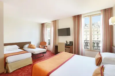 Un ou plusieurs lits dans un hébergement de l'établissement Le Grand Hôtel de Normandie