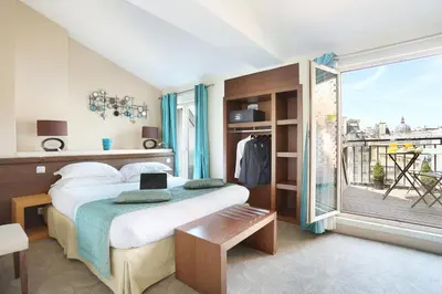 Un ou plusieurs lits dans un hébergement de l'établissement Le Grand Hôtel de Normandie