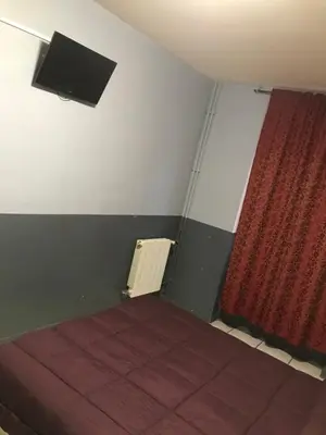 Un ou plusieurs lits dans un hébergement de l'établissement FM Hotel