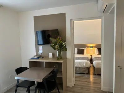 Un ou plusieurs lits dans un hébergement de l'établissement AMHotel Italie