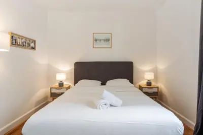 Un ou plusieurs lits dans un hébergement de l'établissement Appartement du Marché St Honoré - Welkeys