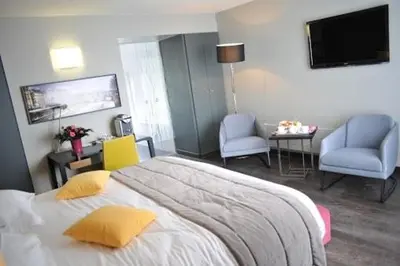Un ou plusieurs lits dans un hébergement de l'établissement Hotel de L'Universite