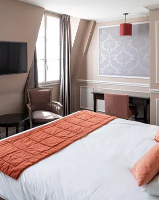 Un ou plusieurs lits dans un hébergement de l'établissement Hotel de L'Universite
