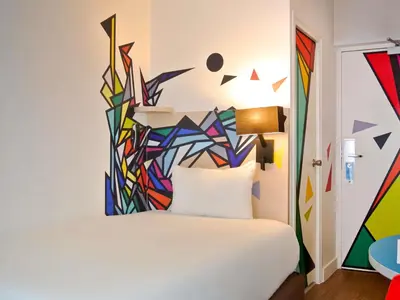 Un ou plusieurs lits dans un hébergement de l'établissement ibis Styles Paris Maine Montparnasse