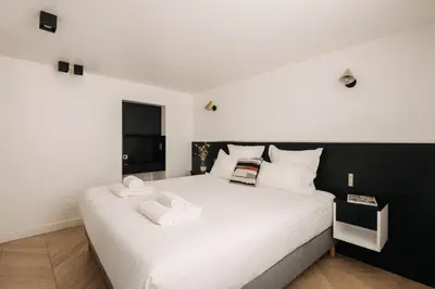 Un ou plusieurs lits dans un hébergement de l'établissement HIGHSTAY - Luxury Serviced Apartments - Place Vendôme