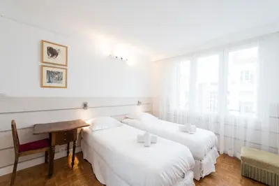 Un ou plusieurs lits dans un hébergement de l'établissement Veeve - Apartment near Pont de Grenelle