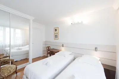 Un ou plusieurs lits dans un hébergement de l'établissement Veeve - Apartment near Pont de Grenelle