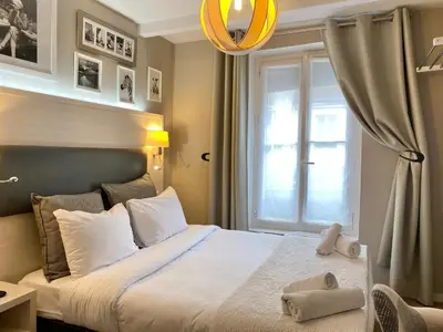 Un ou plusieurs lits dans un hébergement de l'établissement Hôtel Clairefontaine