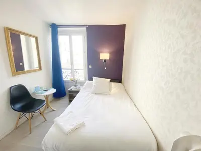 Un ou plusieurs lits dans un hébergement de l'établissement Hotel Aviatic
