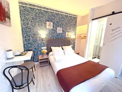 Un ou plusieurs lits dans un hébergement de l'établissement Hotel Aviatic