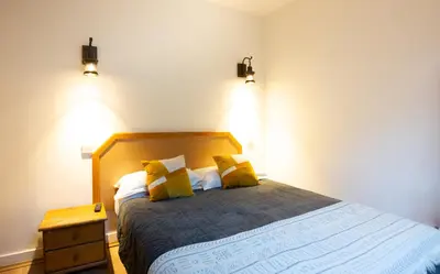 Un ou plusieurs lits dans un hébergement de l'établissement Hôtel Léonard de Vinci II
