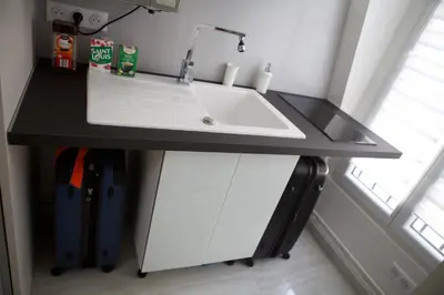 Cuisine ou kitchenette dans l'établissement Studio Tour Eiffel