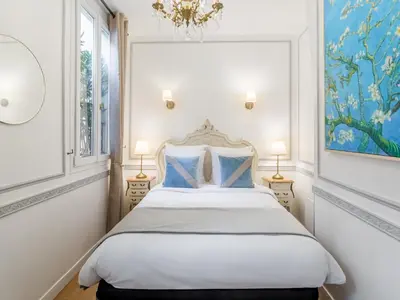 Un ou plusieurs lits dans un hébergement de l'établissement Merveil - Luxury Suite - Louvre - Aboukir IV
