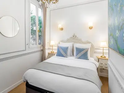 Un ou plusieurs lits dans un hébergement de l'établissement Merveil - Luxury Suite - Louvre - Aboukir IV