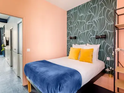 Un ou plusieurs lits dans un hébergement de l'établissement Merveil - Luxury Suite - Marais - Saint Denis I