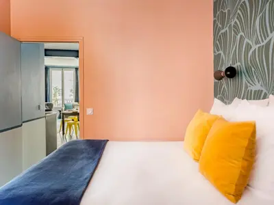 Un ou plusieurs lits dans un hébergement de l'établissement Merveil - Luxury Suite - Marais - Saint Denis I