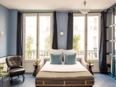Un ou plusieurs lits dans un hébergement de l'établissement Merveil - Luxury Suite - Marais - Saint Denis I