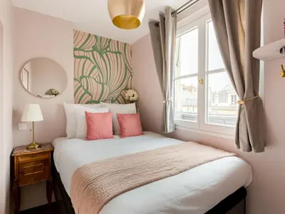 Un ou plusieurs lits dans un hébergement de l'établissement Merveil - Luxury Suite - Champs Elysees - Royale I