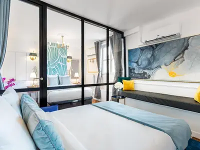 Un ou plusieurs lits dans un hébergement de l'établissement Merveil - Luxury Suite - Champs Elysees - Royale I