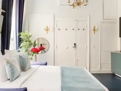Un ou plusieurs lits dans un hébergement de l'établissement Merveil - Luxury Suite - Louvre - Aboukir II
