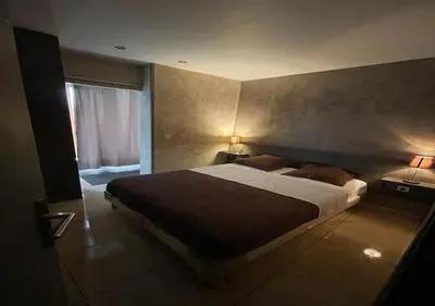Un ou plusieurs lits dans un hébergement de l'établissement LPL Paris Hotel