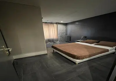 Un ou plusieurs lits dans un hébergement de l'établissement LPL Paris Hotel