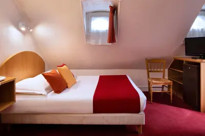 Un ou plusieurs lits dans un hébergement de l'établissement Hôtel Londres Saint Honoré