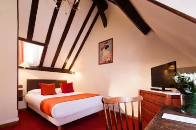 Un ou plusieurs lits dans un hébergement de l'établissement Hôtel Saint Roch