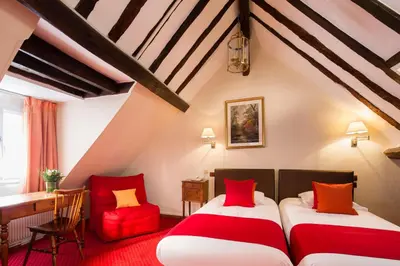 Un ou plusieurs lits dans un hébergement de l'établissement Hôtel Saint Roch