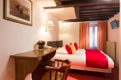Un ou plusieurs lits dans un hébergement de l'établissement Hôtel Saint Roch