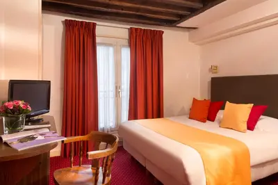 Un ou plusieurs lits dans un hébergement de l'établissement Hôtel Saint Roch