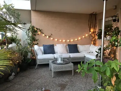Coin salon dans l'établissement F3 Terrasse La défense
