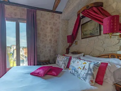 Un ou plusieurs lits dans un hébergement de l'établissement Hotel Minerve