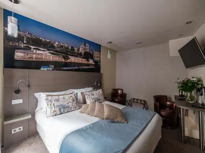 Un ou plusieurs lits dans un hébergement de l'établissement Hotel Minerve