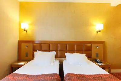 Un ou plusieurs lits dans un hébergement de l'établissement Hotel Bellevue Saint-Lazare