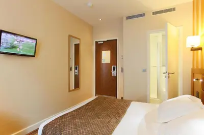 Un ou plusieurs lits dans un hébergement de l'établissement Hotel Bellevue Saint-Lazare