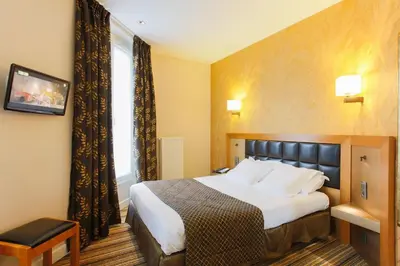 Un ou plusieurs lits dans un hébergement de l'établissement Hotel Bellevue Saint-Lazare