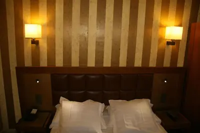 Un ou plusieurs lits dans un hébergement de l'établissement Hotel Bellevue Saint-Lazare