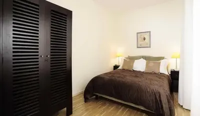 Un ou plusieurs lits dans un hébergement de l'établissement Appartements Caumartin 64