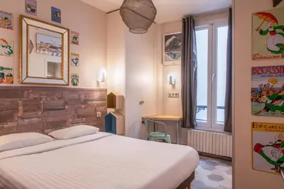 Un ou plusieurs lits dans un hébergement de l'établissement Hôtel de Roubaix