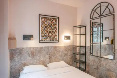 Un ou plusieurs lits dans un hébergement de l'établissement Hôtel de Roubaix