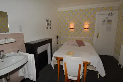Un ou plusieurs lits dans un hébergement de l'établissement Port Royal Hotel