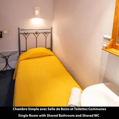 Un ou plusieurs lits dans un hébergement de l'établissement Port Royal Hotel